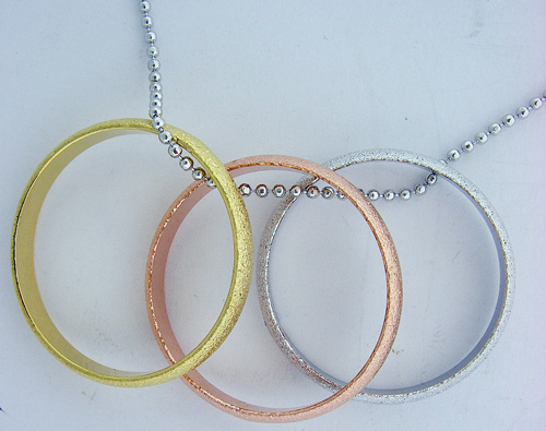 Gold, Bronze and Silver Ring Pendant
